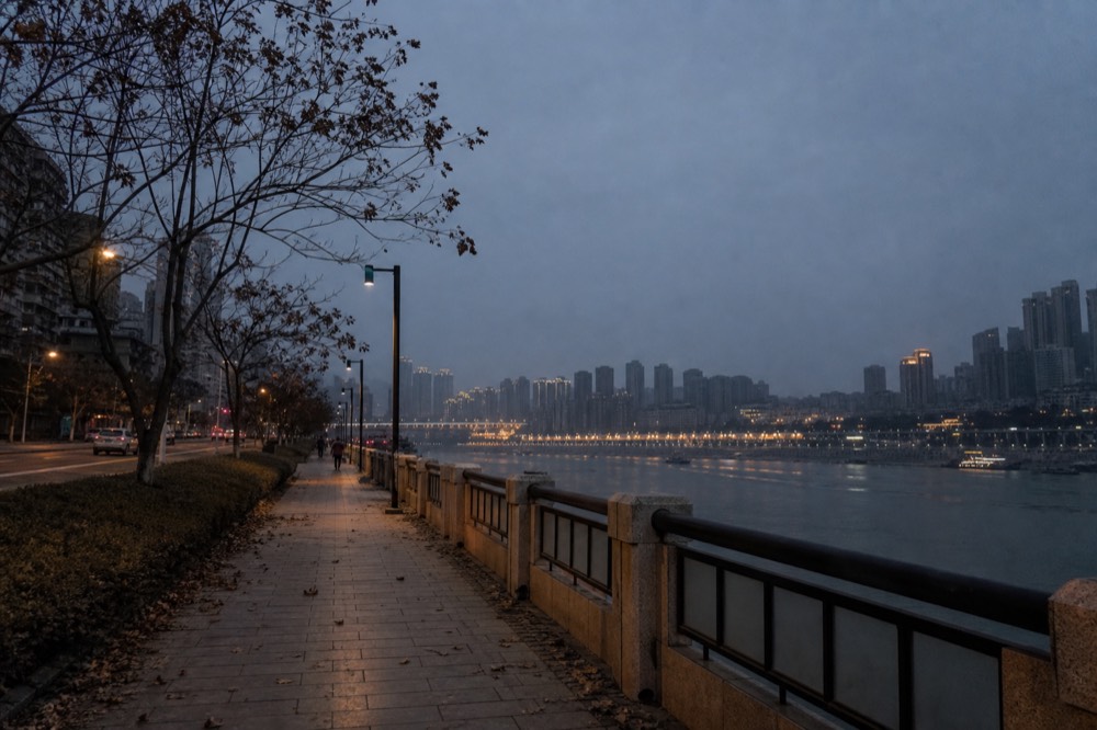 Chongqing riverside promenade at evening twilight in December