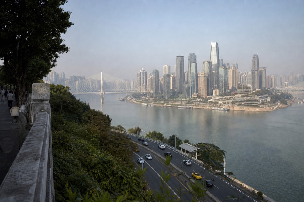 Aerial view of a peninsula city between two rivers with bridges joining the banks