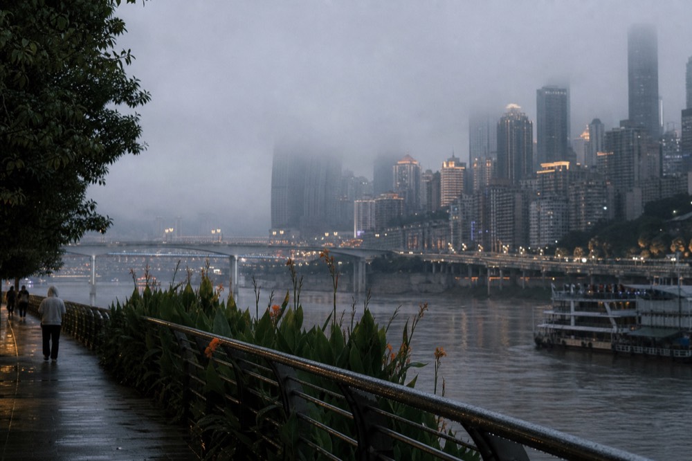 Chongqing skyline with towers rising out of river mist above the Yangtze